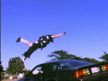 Stuntman jumps over car.