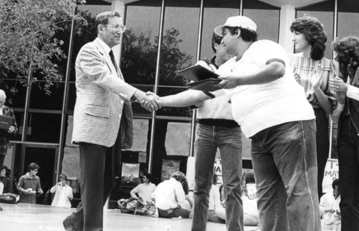 Allan Brown, then CSM Dean of Students, presents an award in the 1980s to student Lenny Vogt
