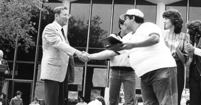 Allan Brown, then CSM Dean of Students, presents an award in the 1980s to student Lenny Vogt