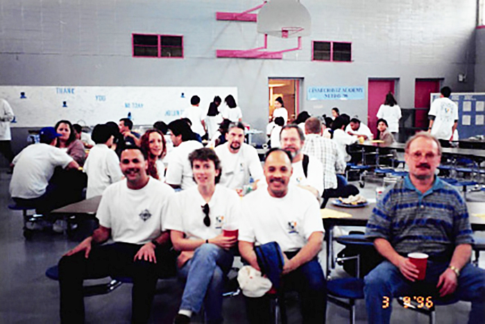 CSM students and other volunteers connect East Palo Alto’s Cesar Chavez Academy to the Internet during NetDay 1996, a statewide initiative that brought the “information superhighway” to dozens of under-resourced California schools