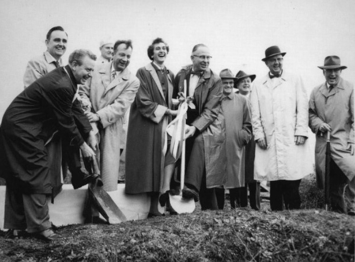 Ringed by fellow trustees, Nettle wields the first shovel at the Jan. 21, 1960 groundbreaking for the College Heights campus