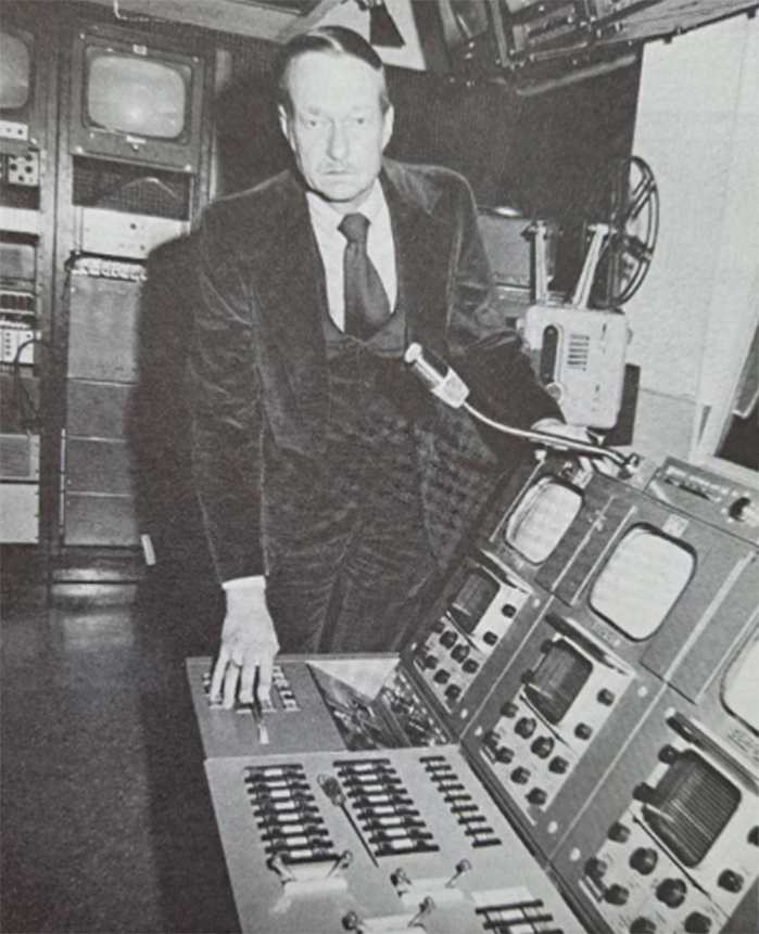 KCSM-TV general manager Doug Montgomery ponders his outdated black-and-white broadcast console in 1977