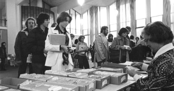 Having collected the IBM punch cards admitting them to their desired classes, mid-1970s students line up in the Student Lounge to enroll